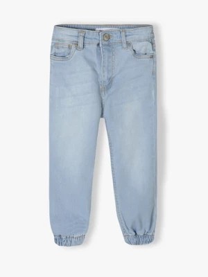 Zdjęcie produktu Jasne spodnie jeansowe typu joggery niemowlęce Minoti