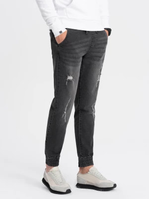 Zdjęcie produktu Męskie spodnie jeansowe JOGGERY z przetarciami - czarne V2 OM-PADJ-0150
 -                                    L