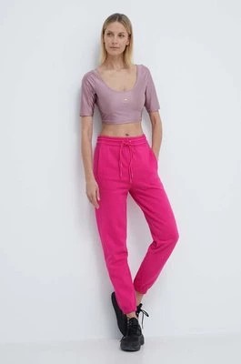 Zdjęcie produktu adidas by Stella McCartney spodnie dresowe kolor różowy gładkie IS1215