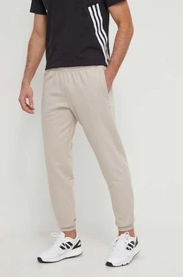 Zdjęcie produktu adidas Originals spodnie dresowe bawełniane kolor beżowy gładkie IR7887