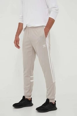Zdjęcie produktu adidas Originals spodnie dresowe kolor beżowy z aplikacją