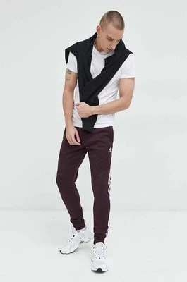 Zdjęcie produktu adidas Originals spodnie dresowe męskie kolor bordowy gładkie