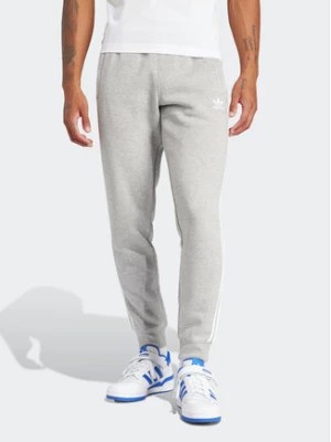 Zdjęcie produktu adidas Spodnie dresowe adicolor 3-Stripes IM9318 Szary Slim Fit