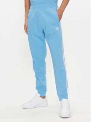 Zdjęcie produktu adidas Spodnie dresowe adicolor 3-Stripes IM9451 Niebieski Slim Fit
