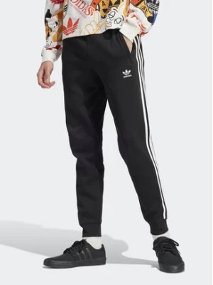 Zdjęcie produktu adidas Spodnie dresowe adicolor 3-Stripes IU2353 Czarny Slim Fit