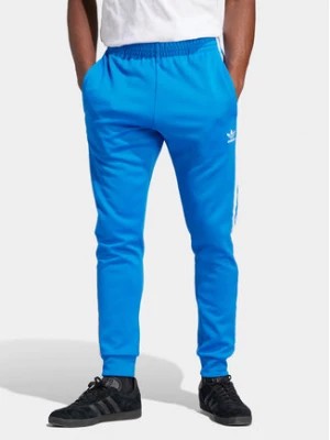 Zdjęcie produktu adidas Spodnie dresowe adicolor Classics SST IM4542 Niebieski Slim Fit