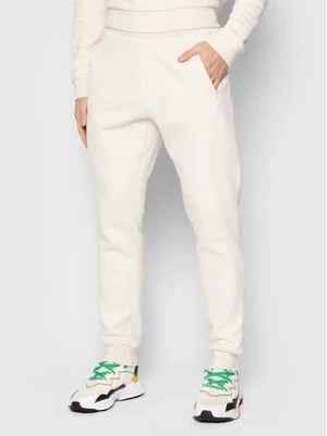 Zdjęcie produktu adidas Spodnie dresowe adicolor Essentials HE9410 Beżowy Slim Fit