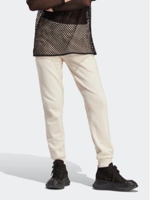 Zdjęcie produktu adidas Spodnie dresowe adicolor Essentials IA6477 Beżowy Slim Fit