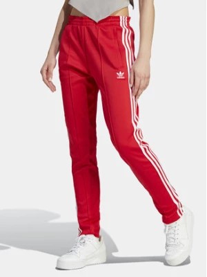 Zdjęcie produktu adidas Spodnie dresowe adicolor SST IK6603 Czerwony Slim Fit