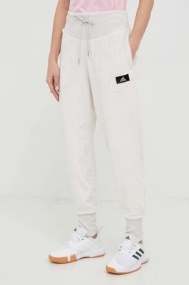 Zdjęcie produktu adidas spodnie dresowe damskie kolor beżowy