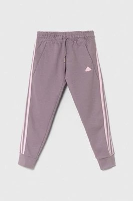 Zdjęcie produktu adidas spodnie dresowe dziecięce kolor fioletowy gładkie