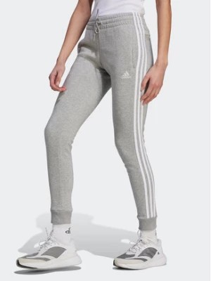 Zdjęcie produktu adidas Spodnie dresowe Essentials 3-Stripes IL3282 Szary Slim Fit