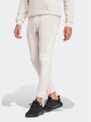 Zdjęcie produktu adidas Spodnie dresowe Future Icons 3-Stripes IR9155 Różowy Slim Fit