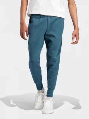 Zdjęcie produktu adidas Spodnie dresowe IN5100 Turkusowy Regular Fit