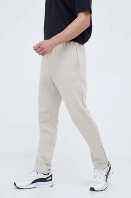 Zdjęcie produktu adidas spodnie dresowe kolor beżowy gładkie
