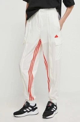 Zdjęcie produktu adidas spodnie dresowe kolor beżowy z aplikacją IS0904