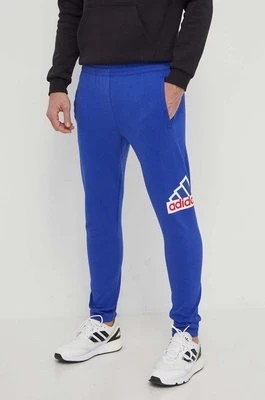 Zdjęcie produktu adidas spodnie dresowe kolor niebieski z nadrukiem IS9594