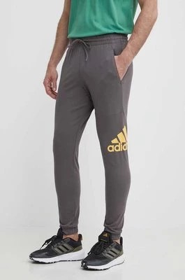 Zdjęcie produktu adidas spodnie dresowe kolor szary z nadrukiem IR9989