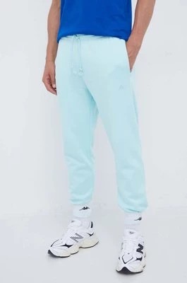 Zdjęcie produktu adidas spodnie dresowe kolor turkusowy gładkie