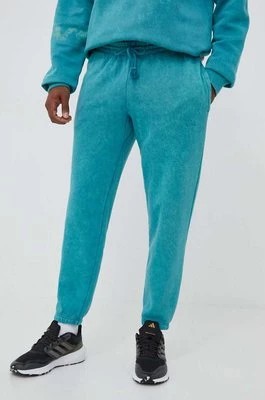 Zdjęcie produktu adidas spodnie dresowe kolor turkusowy wzorzyste