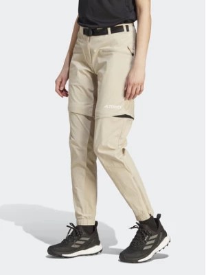 Zdjęcie produktu adidas Spodnie dresowe Terrex Utilitas Hiking Zip-Off Tracksuit Bottoms HZ9046 Beżowy Regular Fit