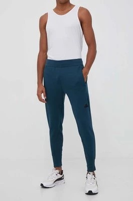 Zdjęcie produktu adidas spodnie dresowe Z.N.E kolor niebieski gładkie