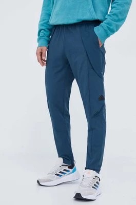 Zdjęcie produktu adidas spodnie męskie kolor turkusowy dopasowane