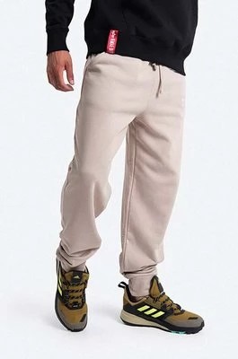 Zdjęcie produktu Alpha Industries spodnie dresowe bawełniane kolor beżowy gładkie 118365.627-BEZOWY