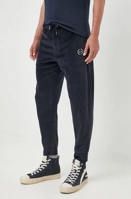 Zdjęcie produktu Armani Exchange spodnie dresowe męskie kolor granatowy gładkie