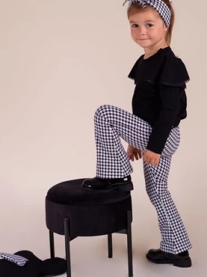 Zdjęcie produktu Bawełniane spodnie dresowe dzwony biało-czarne w pepitkę dla dziewczynki Nicol