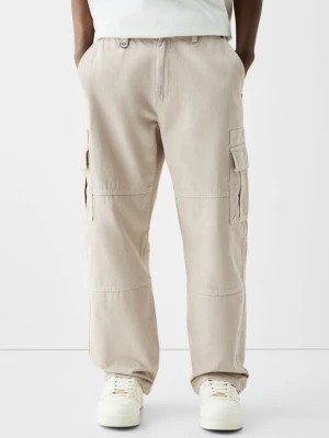 Zdjęcie produktu Bershka Bawełniane Spodnie Cargo Z Kontrastowymi Szwami Mężczyzna Piaskowy
