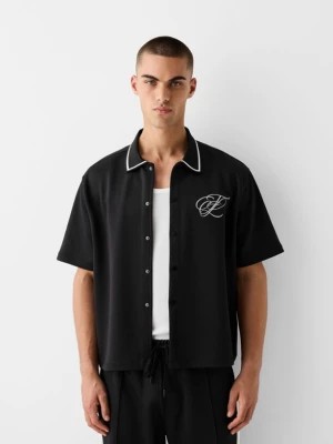 Zdjęcie produktu Bershka Koszula Z Krótkim Rękawem Z Ozdobnym Interlockiem Mężczyzna Czarny