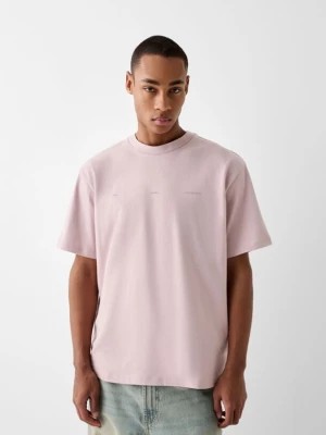 Zdjęcie produktu Bershka Koszulka Boxy Fit Z Krótkim Rękawem I Nadrukiem Mężczyzna Różowy