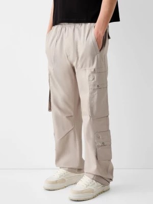 Zdjęcie produktu Bershka Spodnie Wide Leg Multicargo Mężczyzna Piaskowy