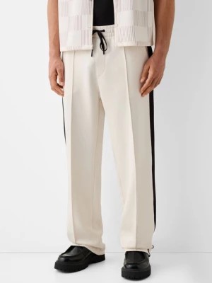 Zdjęcie produktu Bershka Spodnie Z Interlockiem I Bocznymi Paskami Mężczyzna Biały Złamany