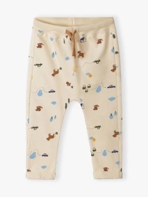 Zdjęcie produktu Beżowe bawełniane spodnie dresowe niemowlęce z nadrukiem 5.10.15.