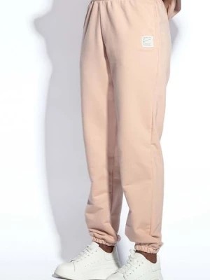 Zdjęcie produktu Beżowe spodnie dresowe damskie z kieszeniami Fobya