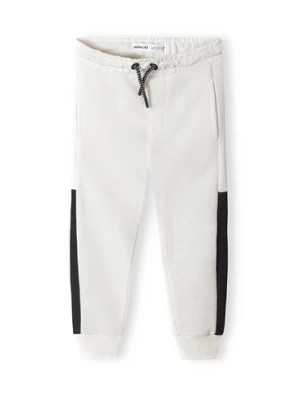 Zdjęcie produktu Białe spodnie dresowe dla niemowlaka z paskami Minoti