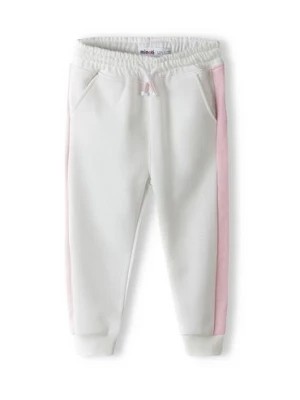 Zdjęcie produktu Białe spodnie dresowe dziewczęce z paskami Minoti