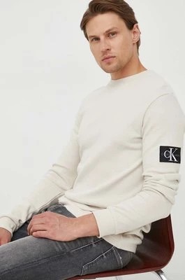 Zdjęcie produktu Calvin Klein Jeans bluza bawełniana męska kolor beżowy z aplikacją