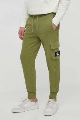 Zdjęcie produktu Calvin Klein Jeans spodnie dresowe bawełniane kolor zielony gładkie