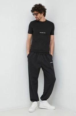 Zdjęcie produktu Calvin Klein Jeans spodnie dresowe kolor czarny z aplikacją