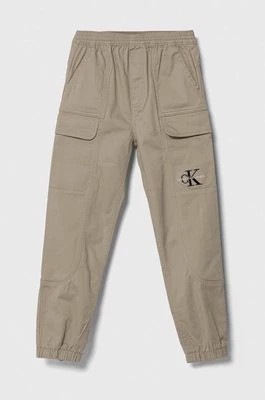 Zdjęcie produktu Calvin Klein Jeans spodnie dziecięce kolor brązowy gładkie