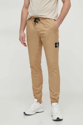 Zdjęcie produktu Calvin Klein Jeans spodnie męskie kolor beżowy dopasowane