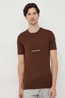 Zdjęcie produktu Calvin Klein Jeans t-shirt bawełniany kolor brązowy z aplikacją
