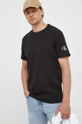 Zdjęcie produktu Calvin Klein Jeans t-shirt bawełniany kolor czarny z aplikacją