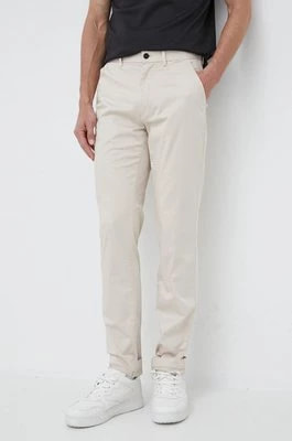 Zdjęcie produktu Calvin Klein spodnie męskie kolor beżowy dopasowane