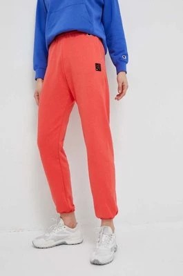 Zdjęcie produktu Champion spodnie dresowe kolor pomarańczowy gładkie