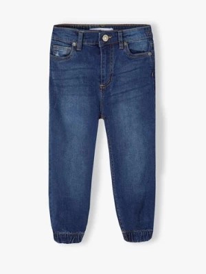Zdjęcie produktu Ciemne spodnie jeansowe typu joggery dziewczęce Minoti