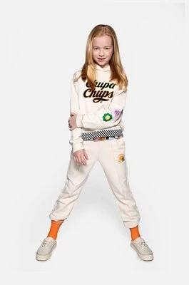 Zdjęcie produktu Coccodrillo spodnie dresowe bawełniane dziecięce kolor beżowy z aplikacją